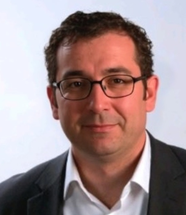 Adrian J Dax